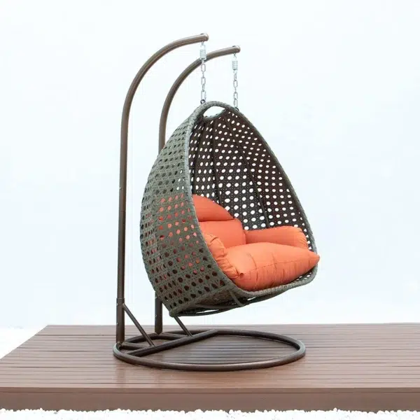 Stylish outdoor egg chair swing with cushion for garden, balcony, or patio relaxation.