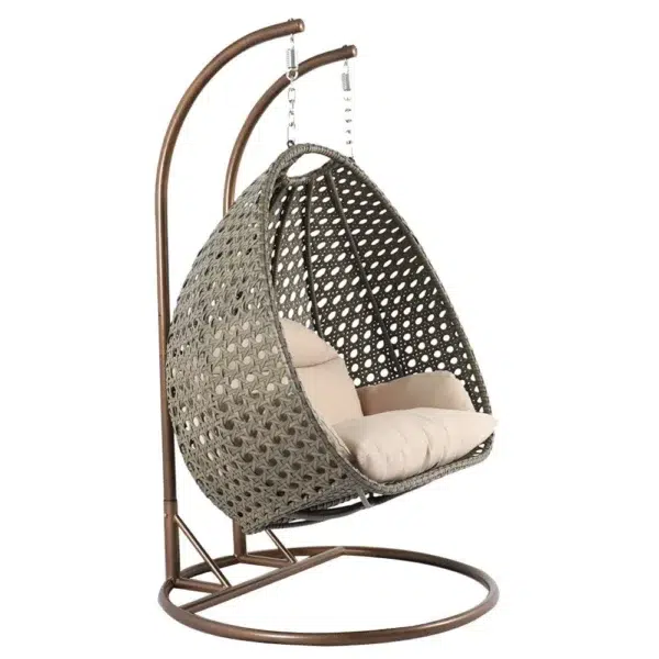 Double seater hanging swing chair with dark brown wicker frame and cream cushions