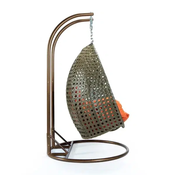 Stylish outdoor egg chair swing with cushion for garden, balcony, or patio relaxation.