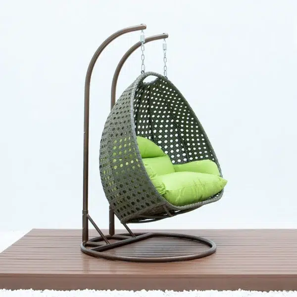 "Outdoor egg chair swing in dark green and light green cushions, perfect for garden or balcony seating"