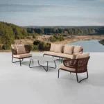 Brown and cream outdoor rope conversation sofa set with cushions on a patio