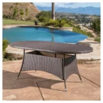 Round outdoor coffee table in dark brown finish, perfect for patio, garden, or balcony settings.