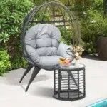Single seater swing basket in black and grey, ideal for balcony and garden relaxation.