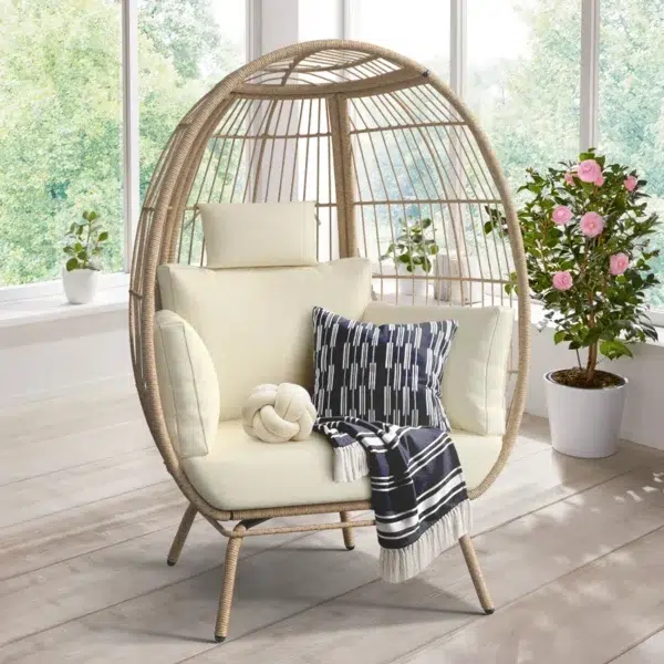 Beige single seater swing basket for balcony and garden with comfortable cushion.
