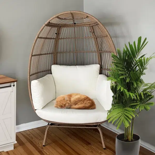 Beige single seater swing basket for balcony and garden with comfortable cushion.