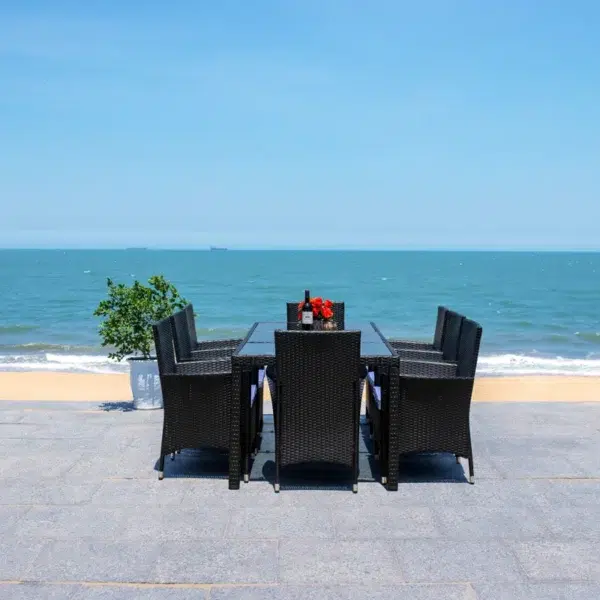 8-person rectangular outdoor dining set with black frame and off-white cushions