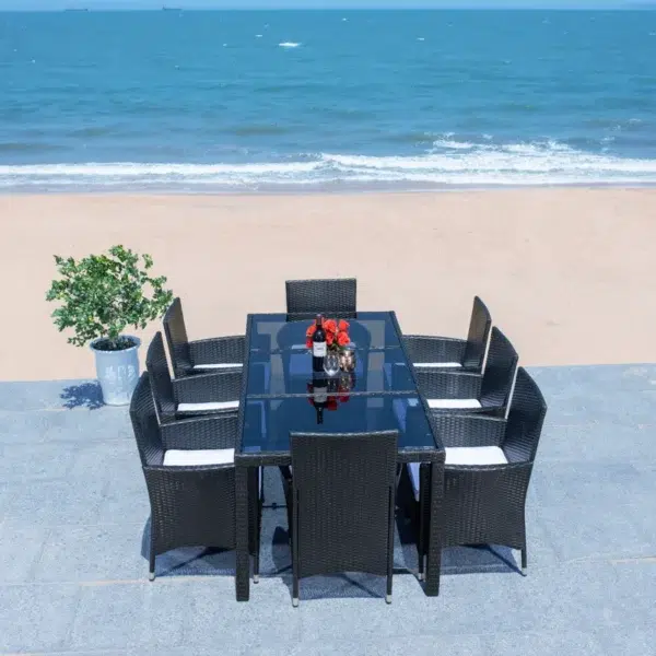 8-person rectangular outdoor dining set with black frame and off-white cushions