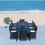 8-person rectangular outdoor dining set with black frame and off-white cushions