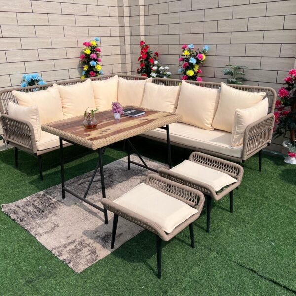 Rope patio sofa set with beige cushions and center table in outdoor garden setting