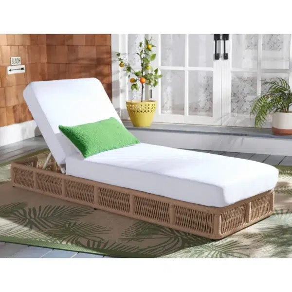 Beige rope sun lounger with a plush white cushion placed outdoors for comfortable lounging.