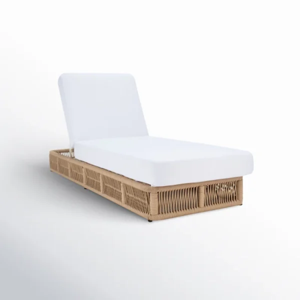 Beige rope sun lounger with a plush white cushion placed outdoors for comfortable lounging.