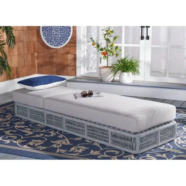 Grey rope sun lounger with soft grey cushion for outdoor use.