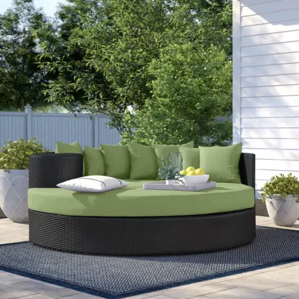 Black and Siya green HDPE wicker outdoor patio daybed with cushions, perfect for lounging in the garden or patio.