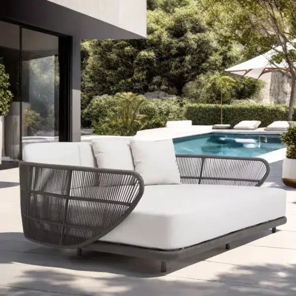Outdoor braided rope patio daybed in black and off-white, perfect for relaxing in the garden or patio.