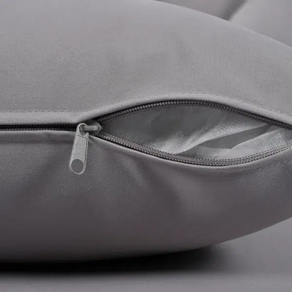 Outdoor patio daybed with black woven nylon rope backrest and light grey washable cushion