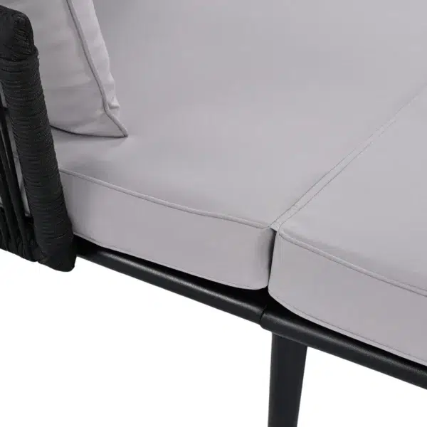 Outdoor patio daybed with black woven nylon rope backrest and light grey washable cushion