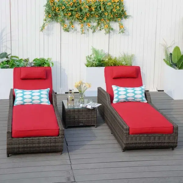 Dark brown rattan outdoor reclining chaise lounge with sky blue cushions.