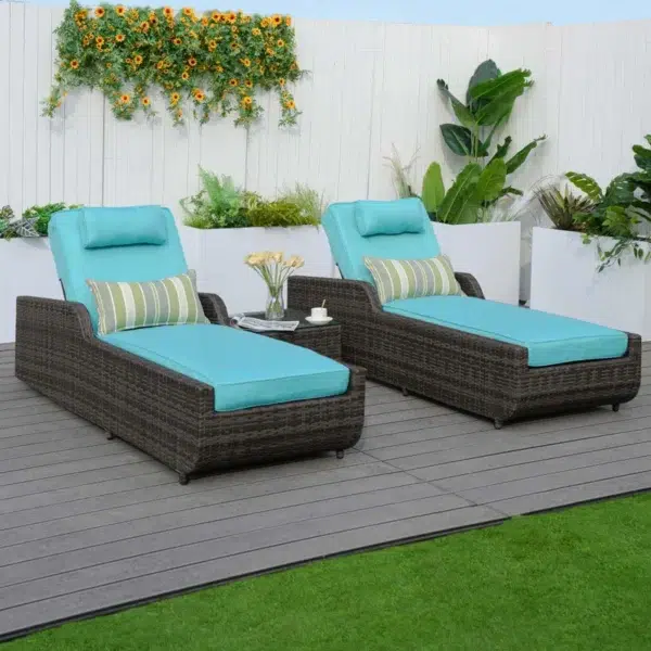 Dark brown rattan outdoor reclining chaise lounge with sky blue cushions.