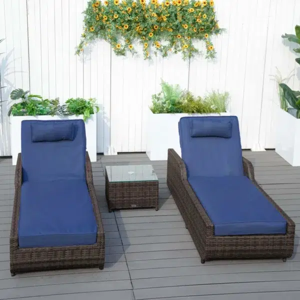 Dark brown rattan outdoor reclining chaise lounge with blue cushions.