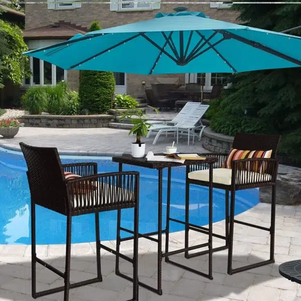 Outdoor patio bar set with two brown chairs and matching table, ideal for garden or terrace.