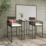 Outdoor patio bar set with two brown chairs and matching table, ideal for garden or terrace.