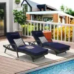 Set of 2 long reclining outdoor wicker chaise lounge chairs with cushions, perfect for patio or garden.