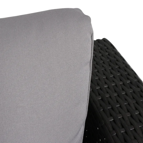 4 seater outdoor wicker sectional sofa set in brown frame with light grey cushions placed on a patio.