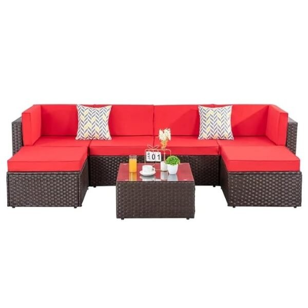Outdoor sofa set with cushioned seats on a garden patio, weather-resistant wicker frame, and stylish modern design.