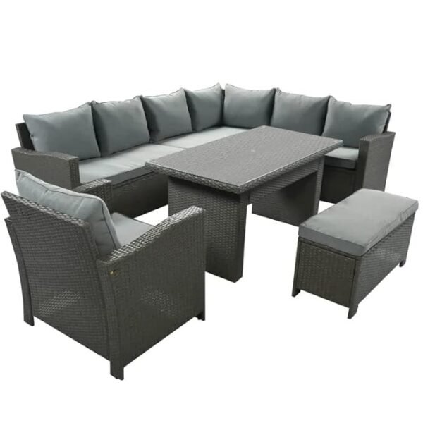 Outdoor rattan wicker patio sofa set with matching dining table on a backyard terrace