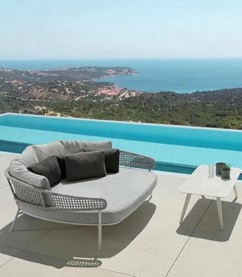 Elegant modern daybed with upholstered cushions and wooden frame, perfect for living room or bedroom