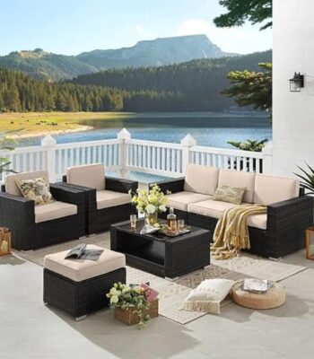 "5-piece outdoor seating set in brown rattan wicker with cream cushions, including a spacious seater and matching chairs, ideal for patio or garden lounging."