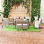 6-piece outdoor conversation patio furniture set in all-weather wicker with cushions.