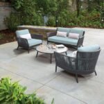 "Modern outdoor 4-seater wicker sofa set with cushions, perfect for patio, garden, or backyard seating."