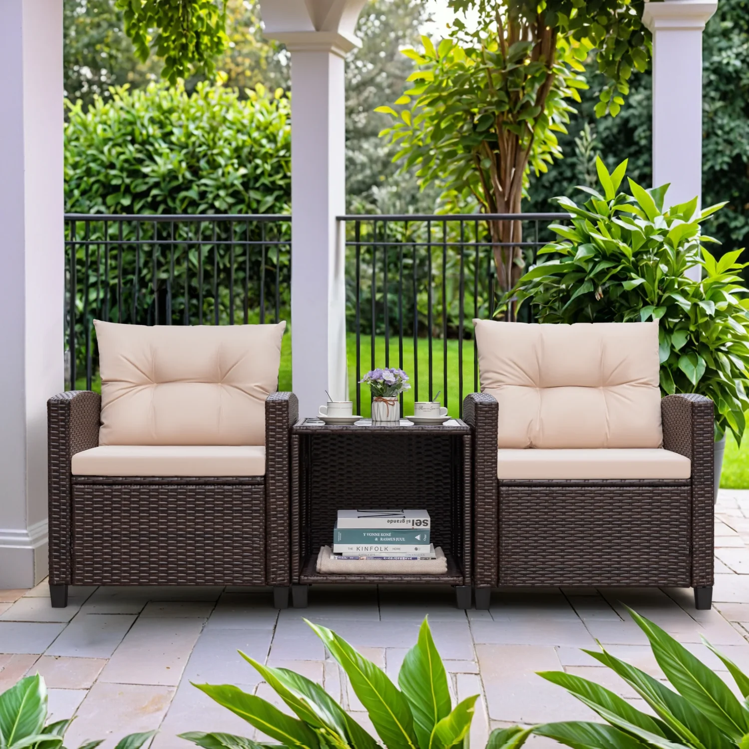 Three-piece outdoor patio furniture set featuring woven rattan chairs with beige cushions on a wooden deck.