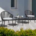 3-piece outdoor patio bistro set with rope detailing and comfortable cushions, featuring two chairs and a round table