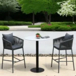Outdoor grey rope bar set with two chairs and a table.