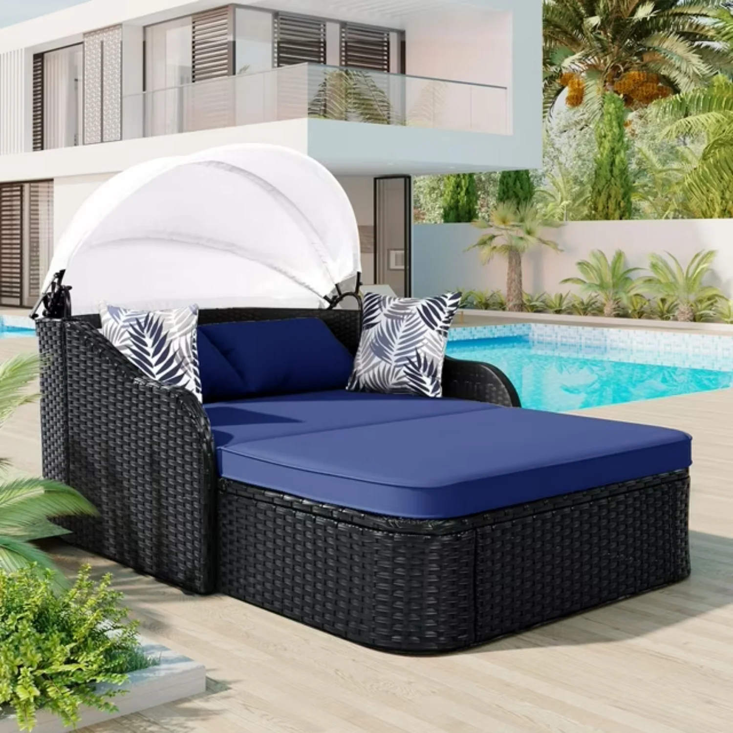 Outdoor rattan wicker double seater canopy daybed with cushions for patio and garden relaxation.