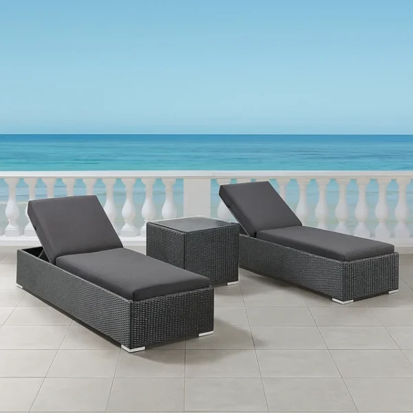 Set of 2 outdoor wicker lounge chairs with cushions on a patio