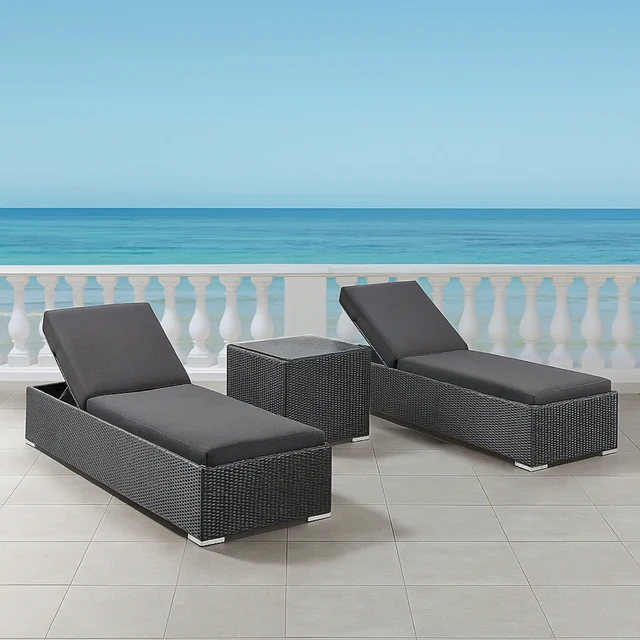 Set of 2 outdoor wicker lounge chairs with cushions on a patio