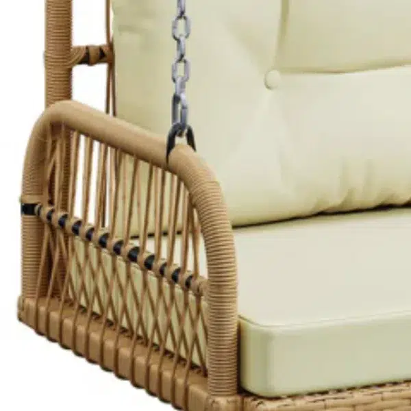 Outdoor beige rattan wicker two-seater sofa swing with cushions for patio or garden