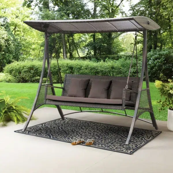 3-seat outdoor rattan wicker patio swing chair with beige cushions and adjustable canopy shade