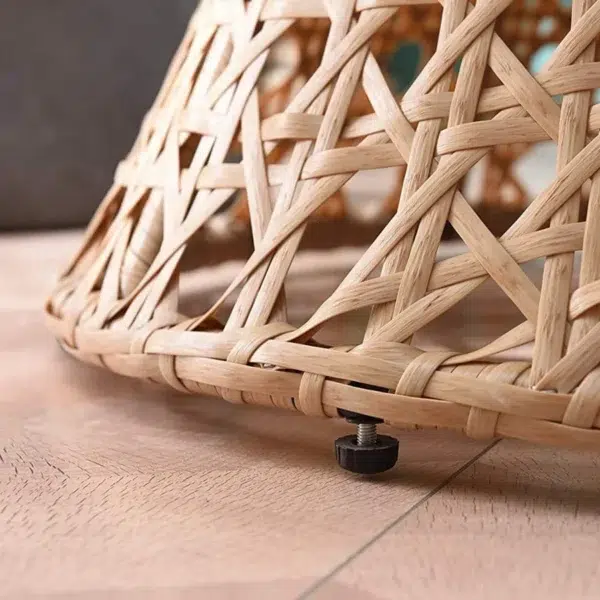 Beige rattan wicker cocoon chair with a comfortable cushion for outdoor patio or garden
