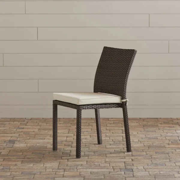 Outdoor rattan wicker patio dining chair with sturdy metal frame and comfortable cushion for garden or balcony use.