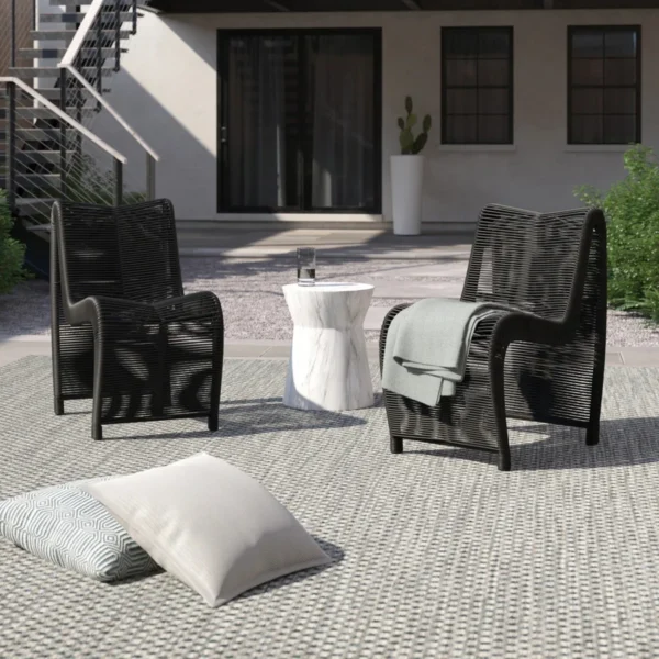 Two modern outdoor rope patio chairs with metal frames and woven seats, perfect for garden or balcony seating.