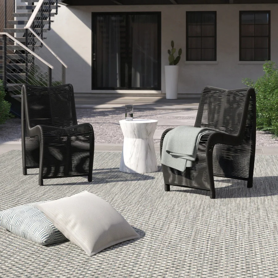 Two modern outdoor rope patio chairs with metal frames and woven seats, perfect for garden or balcony seating.