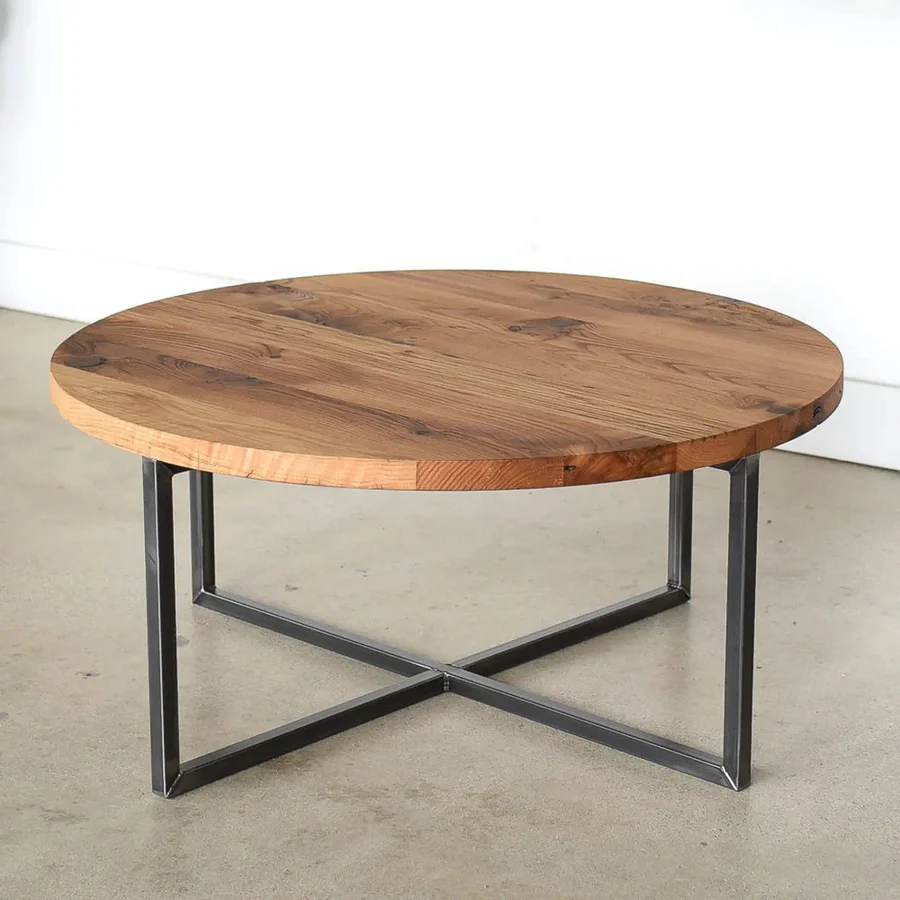 "Round coffee table with natural Sheesham wood top and sturdy base"