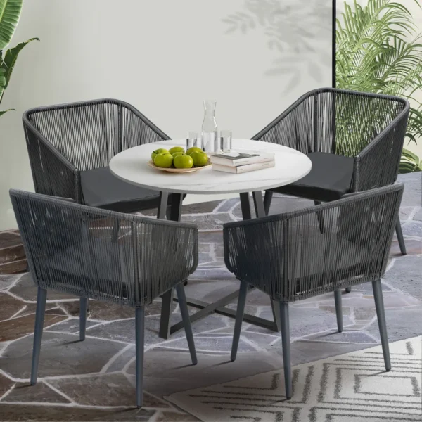 Alt Text: 5-piece outdoor patio dining set with rope chairs and marble-top table on a terrace