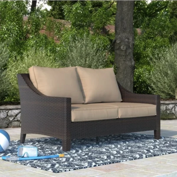 Stylish outdoor rattan wicker loveseat sofa with soft cushions, perfect for patio or garden seating.