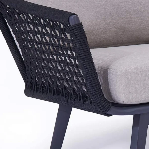 2-piece outdoor rope loveseat sofa with matching ottoman on a patio, featuring weather-resistant cushions
