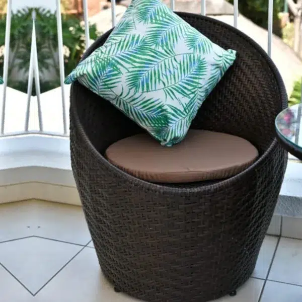 Modern 3-piece outdoor rattan wicker conversation set with two cushioned chairs and a matching glass-top table
